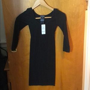 Bebe dress NWT black with a triangle open back